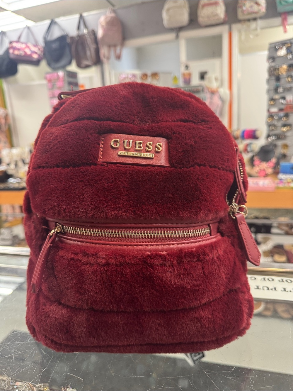 GUESS Burgundy Faux Fur Mini Backpack with Gold Hardware